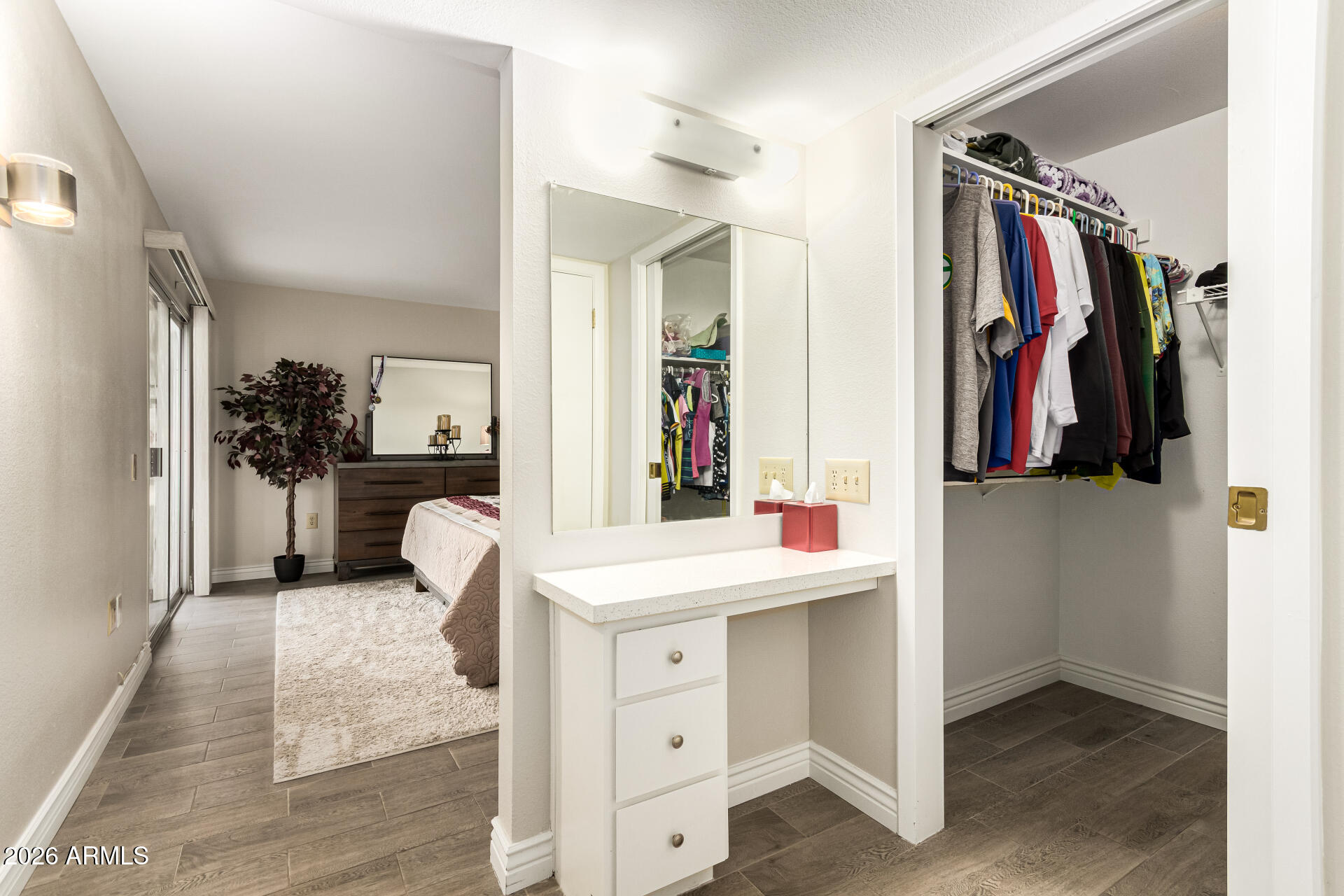 19618 North Star Ridge Drive Sun City West, AZ 85375 - Photo 21 of 37 a view of walk in closet with clothes and shoes