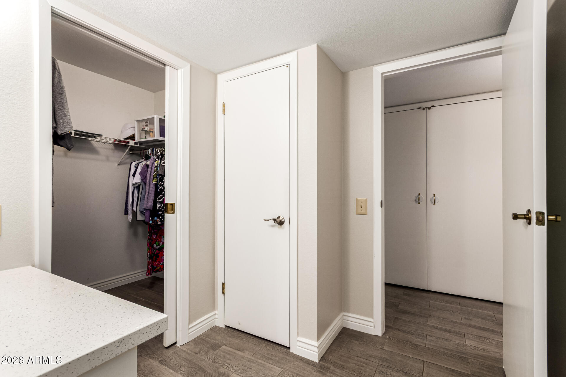 19618 North Star Ridge Drive Sun City West, AZ 85375 - Photo 22 of 37 a view of a hallway with closet and wooden floor
