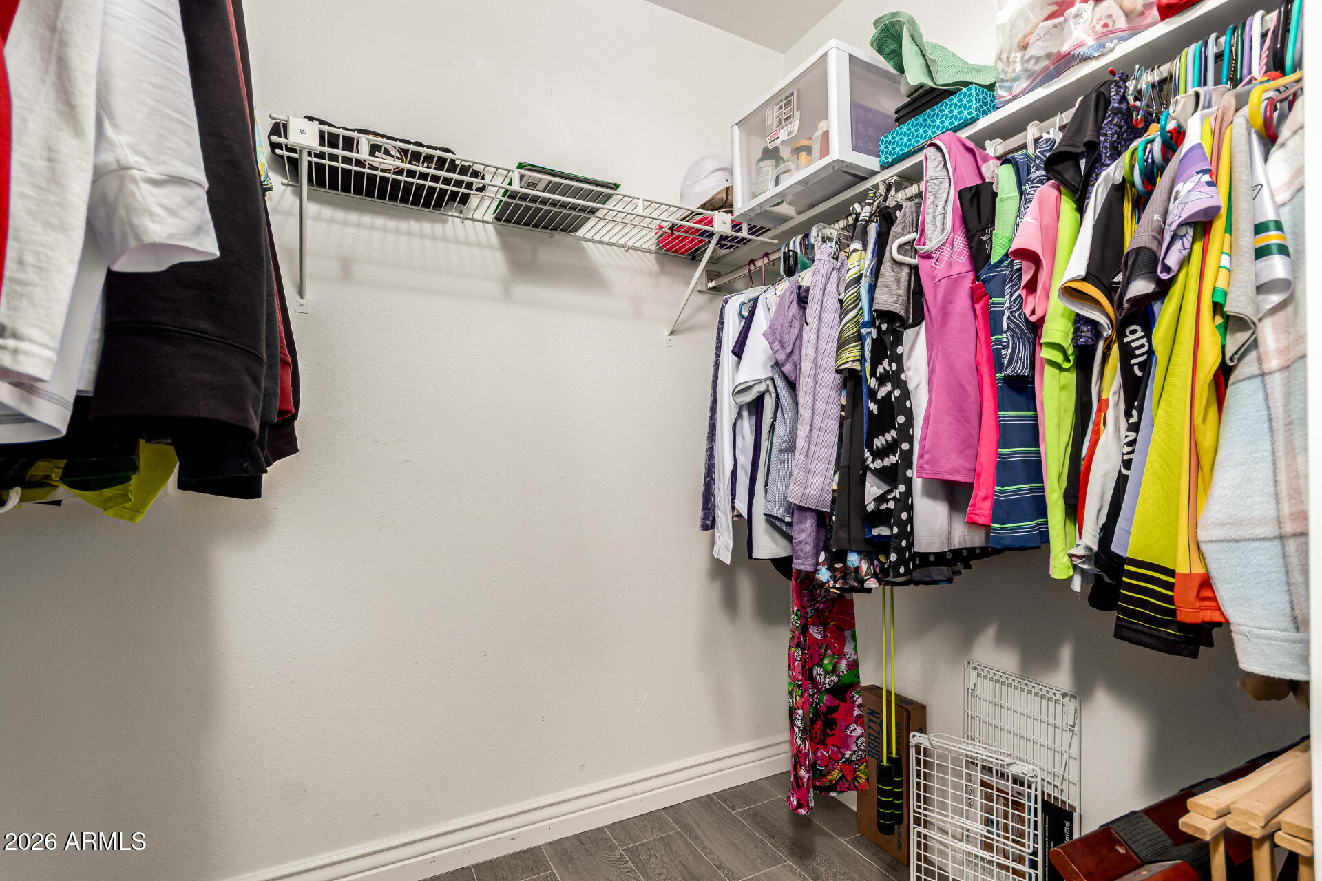 19618 North Star Ridge Drive Sun City West, AZ 85375 - Photo 23 of 37 a view of walk in closet with clothes