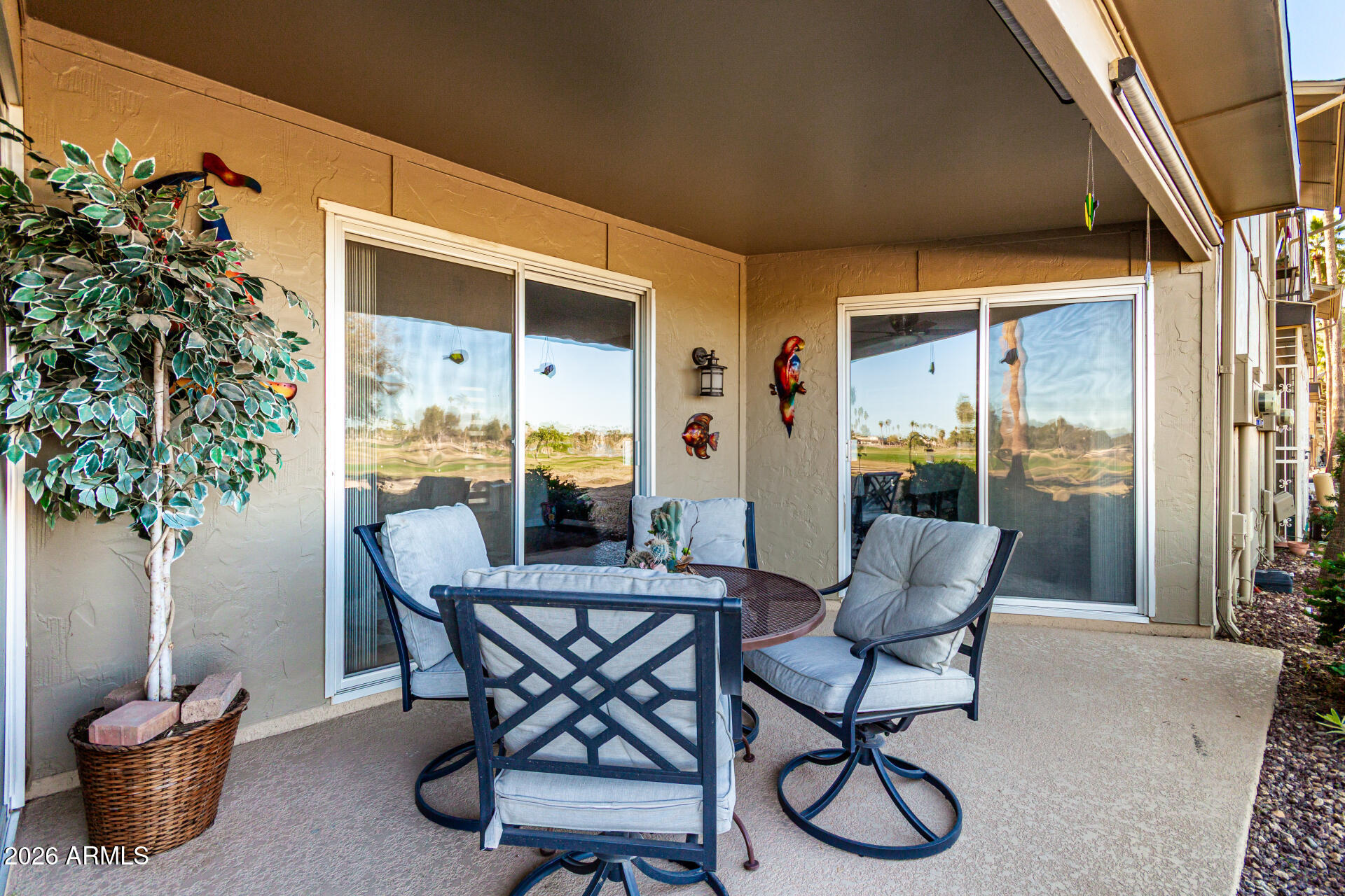 19618 North Star Ridge Drive Sun City West, AZ 85375 - Photo 29 of 37 a view of an outdoor dining space with furniture and front door