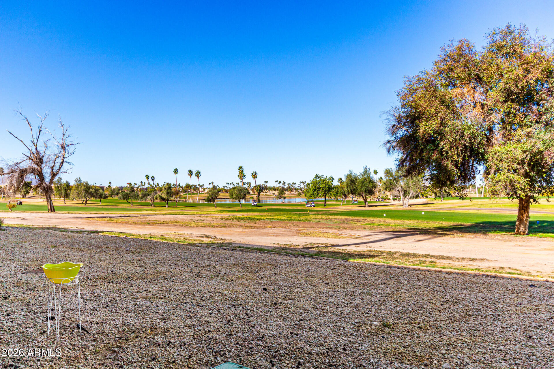 19618 North Star Ridge Drive Sun City West, AZ 85375 - Photo 31 of 37 a view of a swimming pool with an outdoor space and seating area