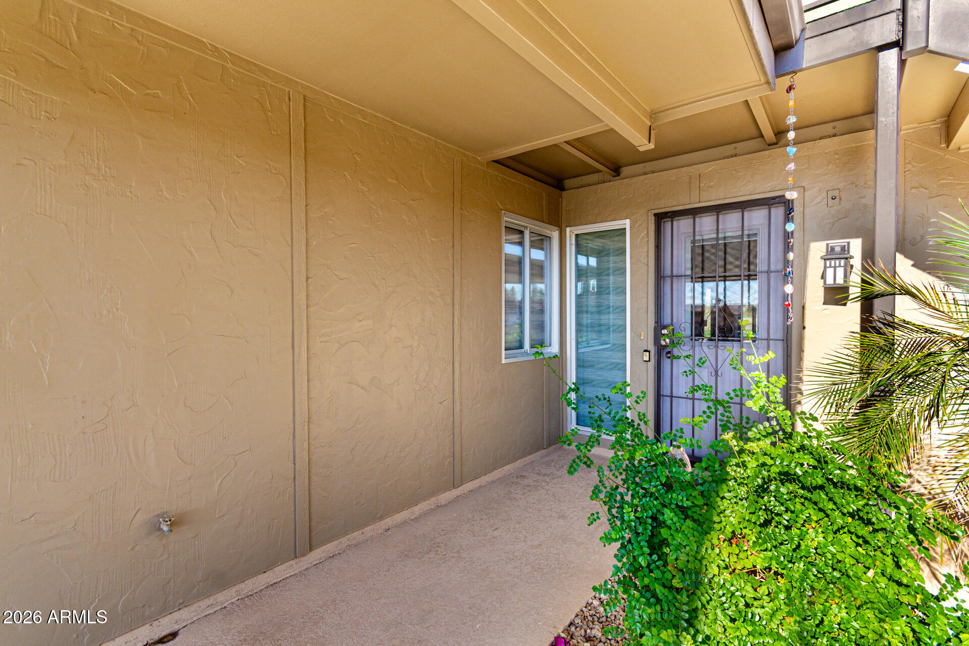 19618 North Star Ridge Drive Sun City West, AZ 85375 - Photo 4 of 37 front view of a house with a glass door