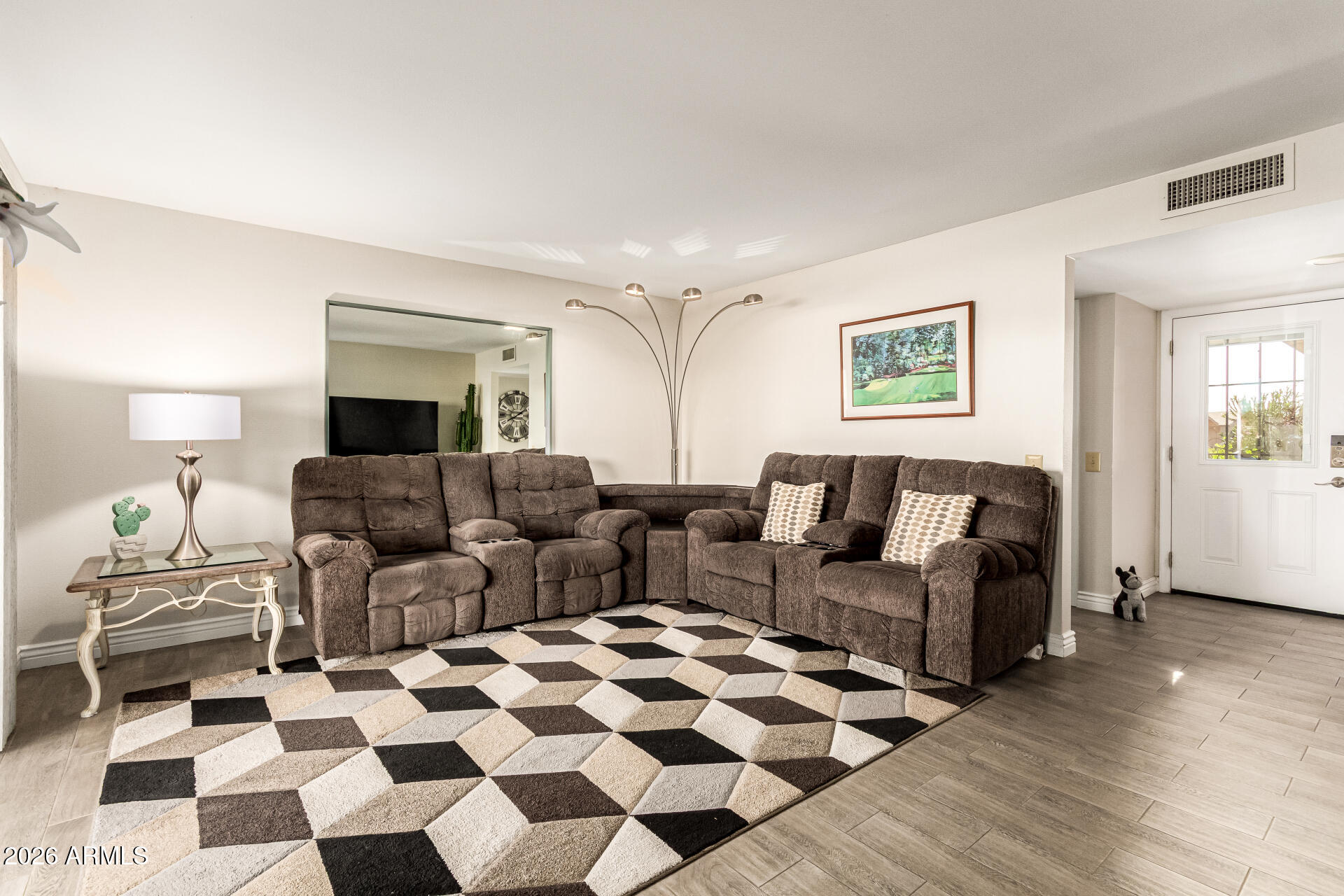 19618 North Star Ridge Drive Sun City West, AZ 85375 - Photo 6 of 37 a living room with furniture and a rug
