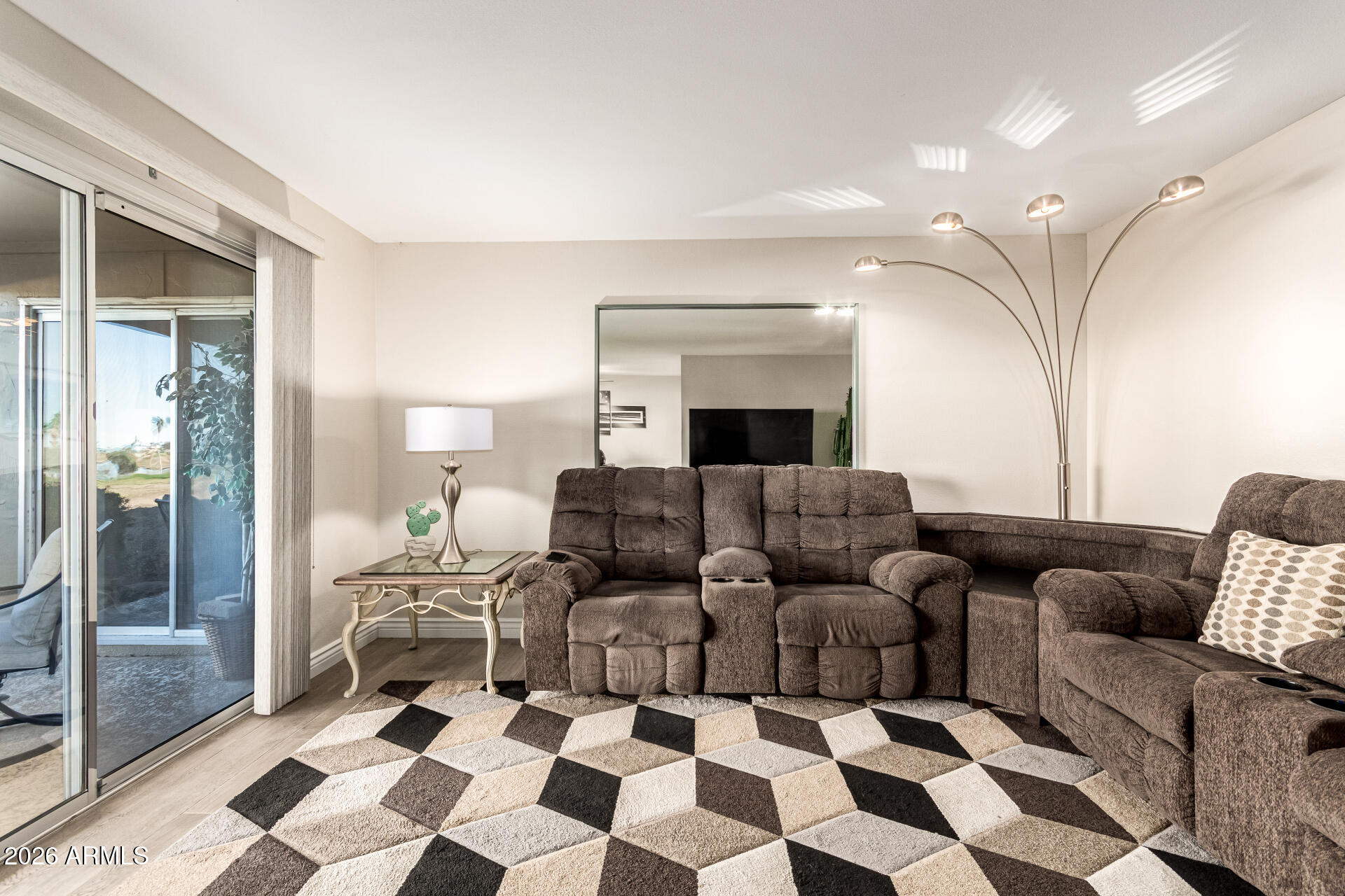 19618 North Star Ridge Drive Sun City West, AZ 85375 - Photo 8 of 37 a living room with furniture and a rug