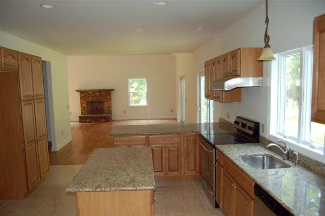 746 Foley Road Sheffield, MA 01257 - Photo 2 of 6 a kitchen with granite countertop a sink a counter top space appliances and cabinets