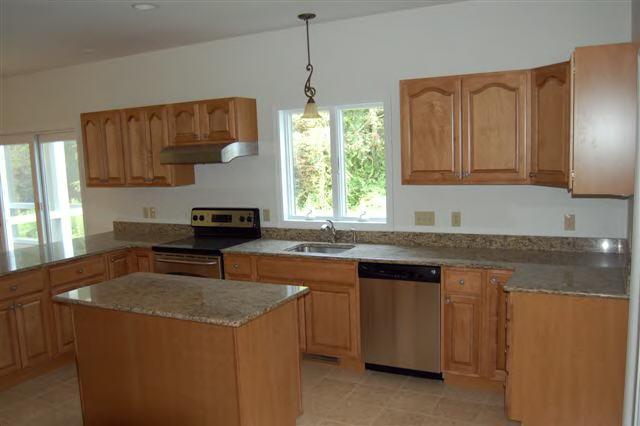 746 Foley Road Sheffield, MA 01257 - Photo 4 of 6 a kitchen with a sink stove and cabinets