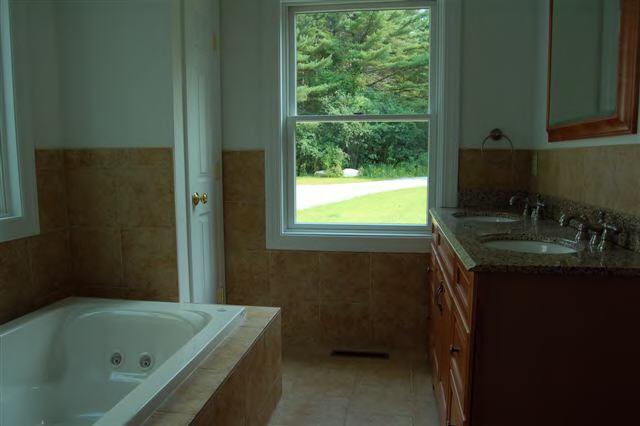 746 Foley Road Sheffield, MA 01257 - Photo 6 of 6 a bathroom with a tub sink and mirror
