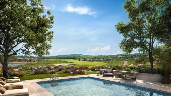 a view of a lake with couches in the patio