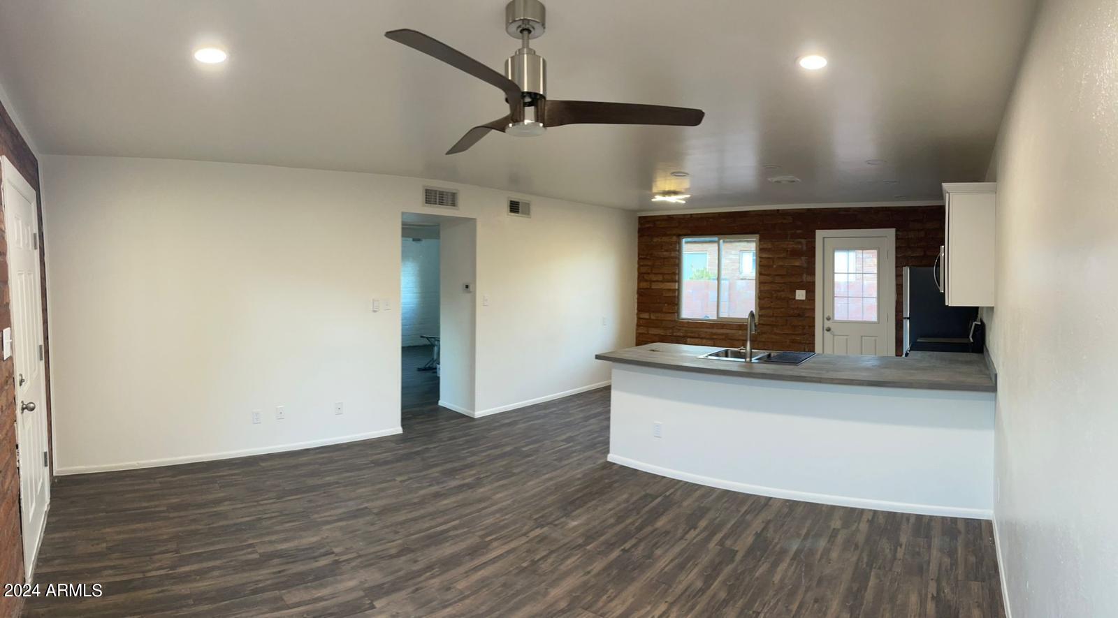 1006 South Dorsey Lane, Unit 16 Tempe, AZ 85281 - Photo 9 of 10 a view of living room with wooden floor
