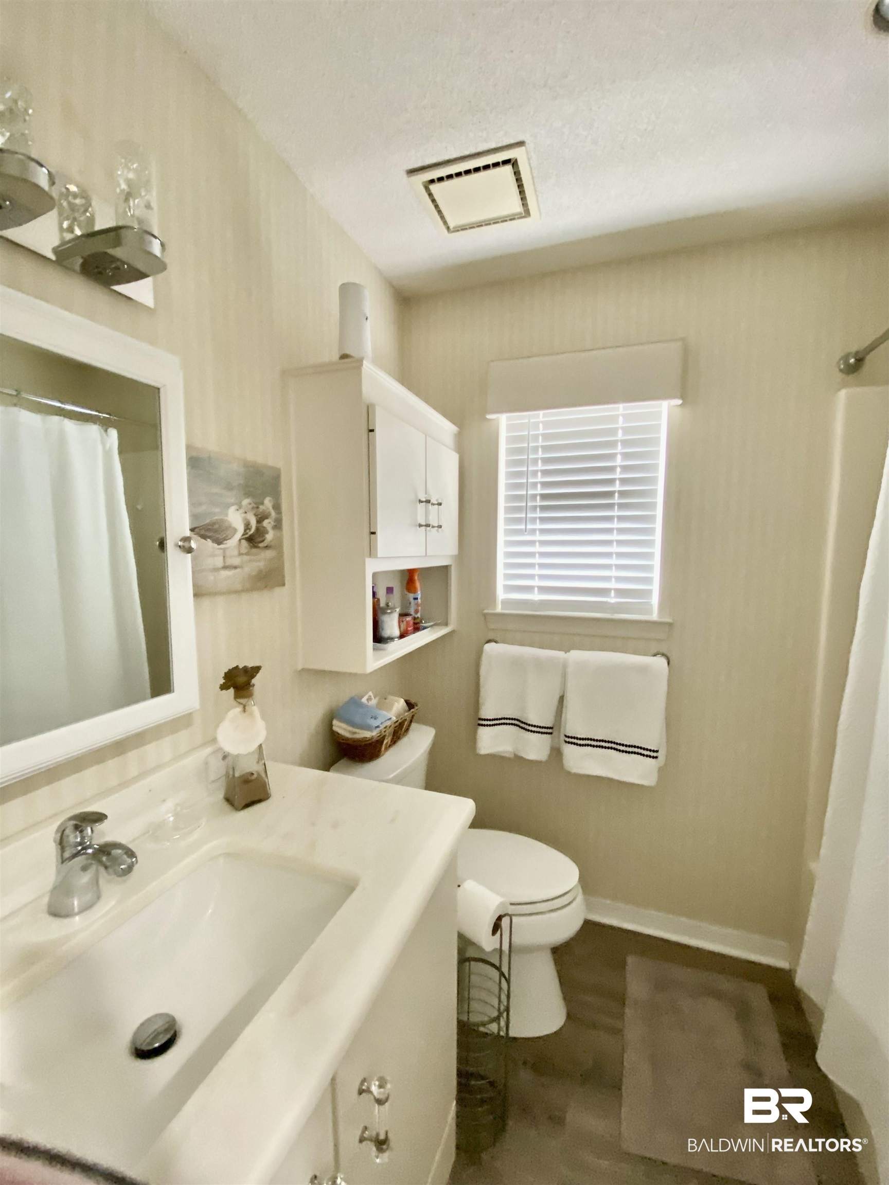 2872 Avenida Alberto Lillian, AL 36549 - Photo 28 of 31 Bathroom with vanity, wood-type flooring, a textured ceiling, and toilet