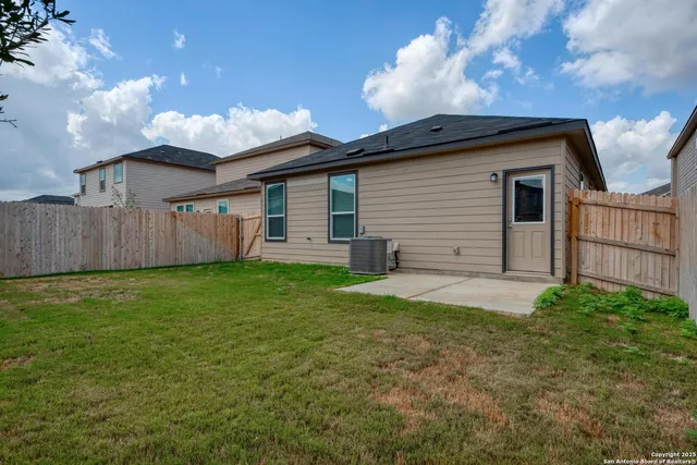 a backyard of a house with lots of green space