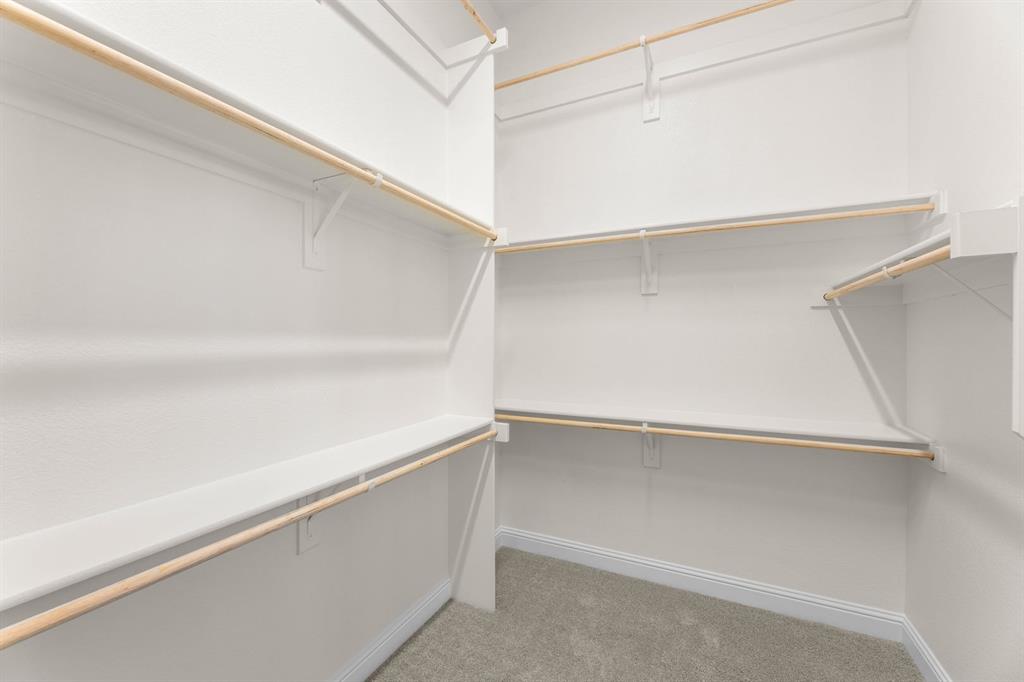 4802 Timberdrift Street Midlothian, TX 76065 - Photo 32 of 34 a view of an empty walk in closet