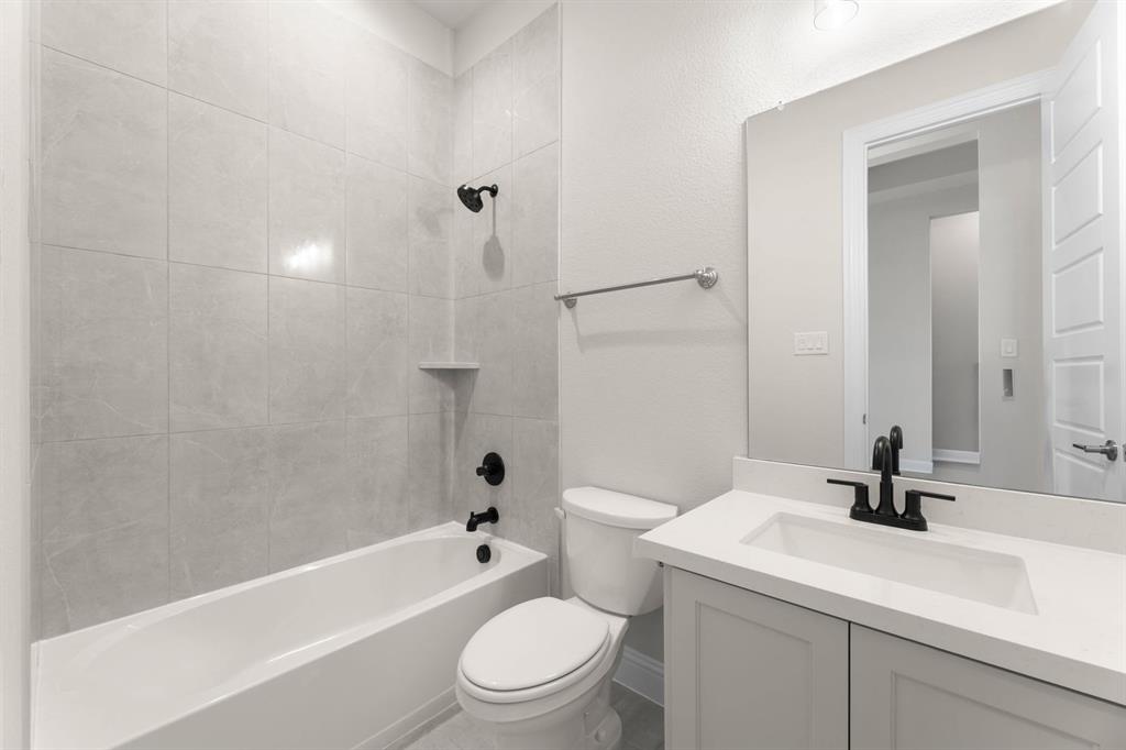 4802 Timberdrift Street Midlothian, TX 76065 - Photo 34 of 34 a bathroom with a sink a toilet and shower