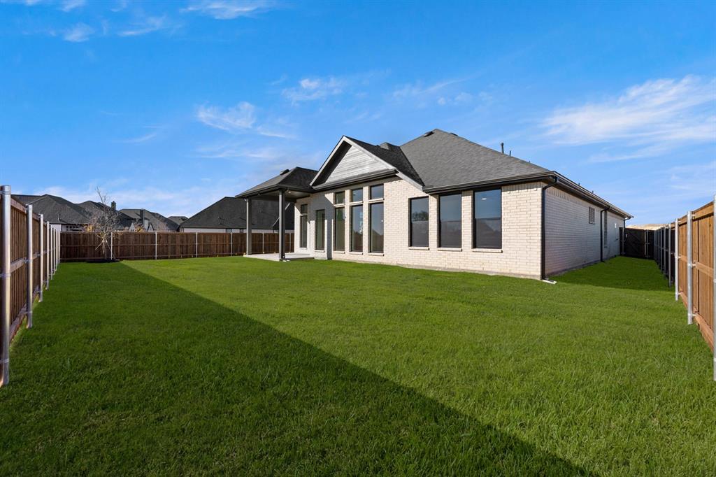 4802 Timberdrift Street Midlothian, TX 76065 - Photo 4 of 34 a front view of a house with a garden