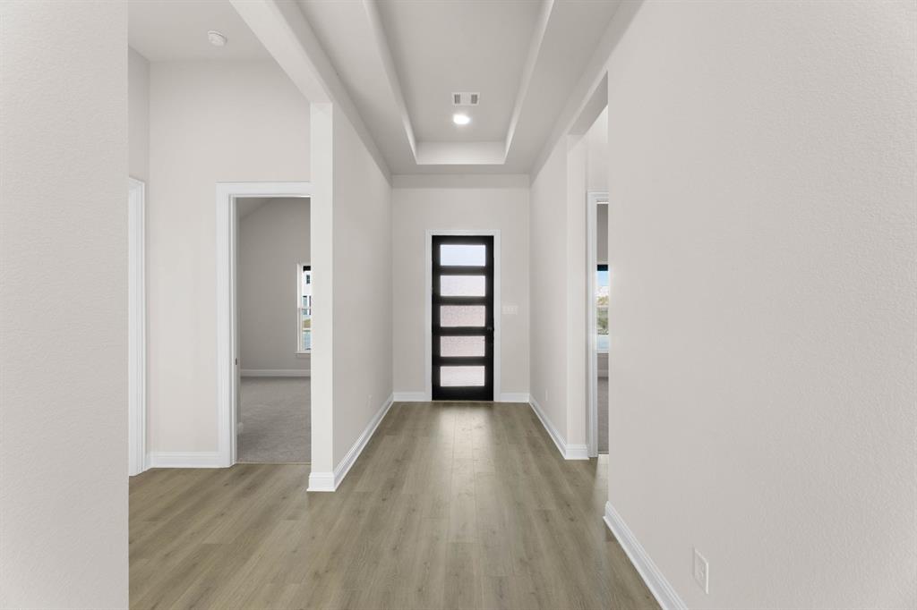 4802 Timberdrift Street Midlothian, TX 76065 - Photo 7 of 34 a view of a hallway with wooden floor