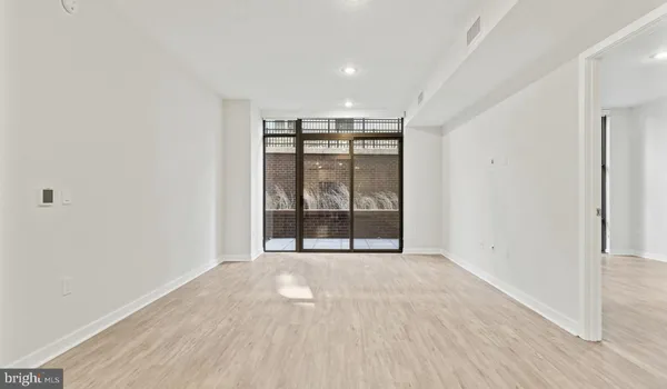 a close view of a utility room with dryer and washer