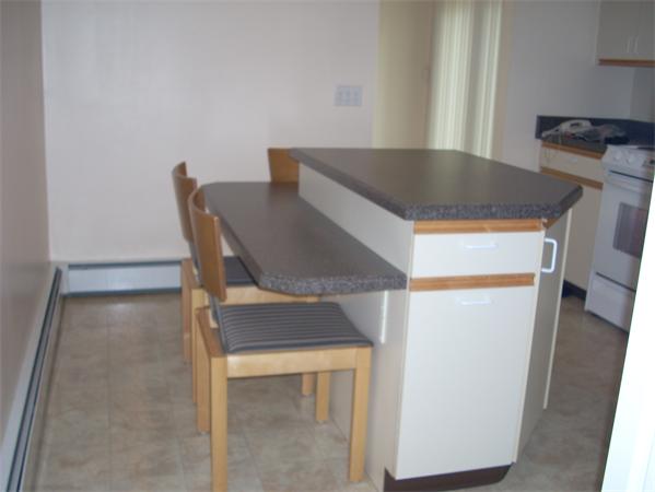 68 Patterson Avenue Springfield, MA 01119 - Photo 12 of 24 a workspace with furniture and wooden floor