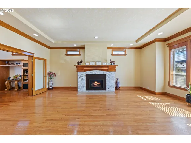 a view of an empty room and fire place