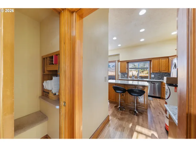 a dining room with furniture and a kitchen