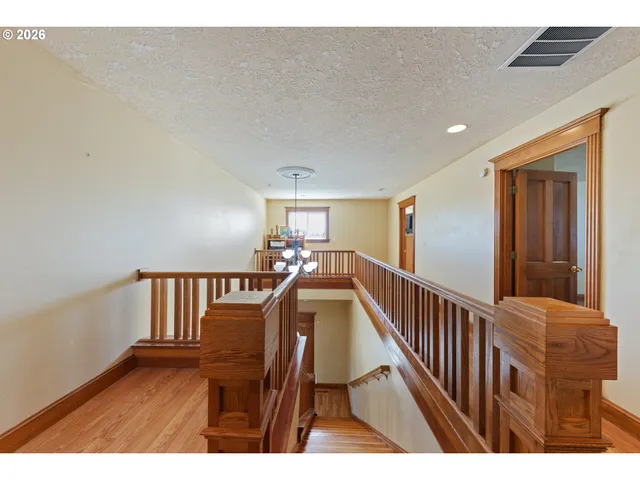a view of a hallway with staircase