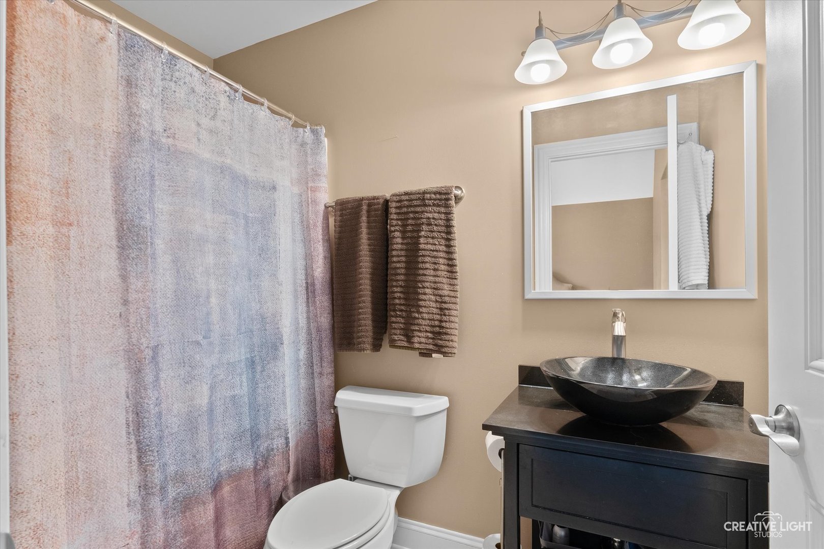 2086 Bilter Road Aurora, IL 60502 - Photo 24 of 59 a bathroom with a toilet sink and mirror