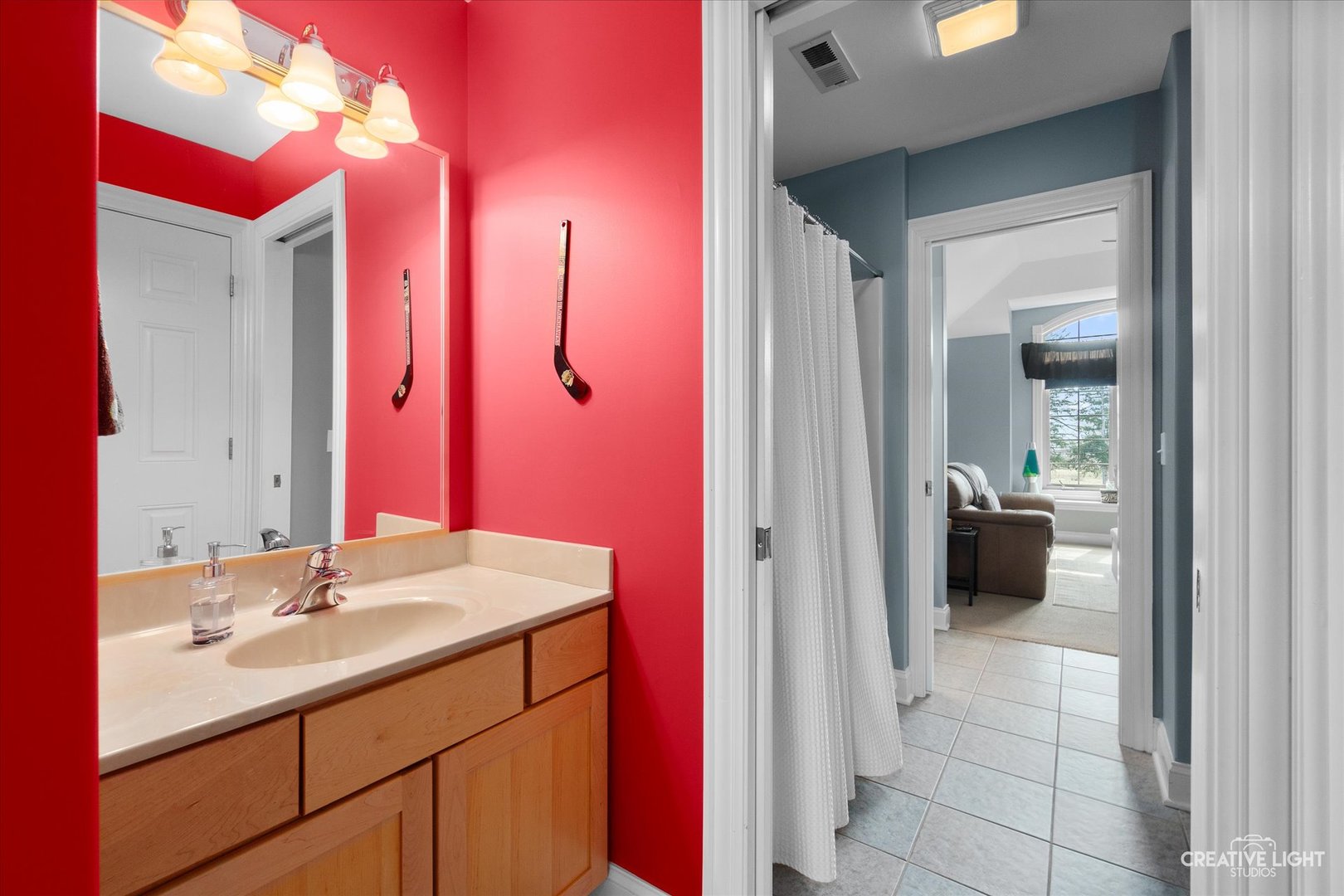 2086 Bilter Road Aurora, IL 60502 - Photo 27 of 59 a en suite bathroom with a sink and a mirror