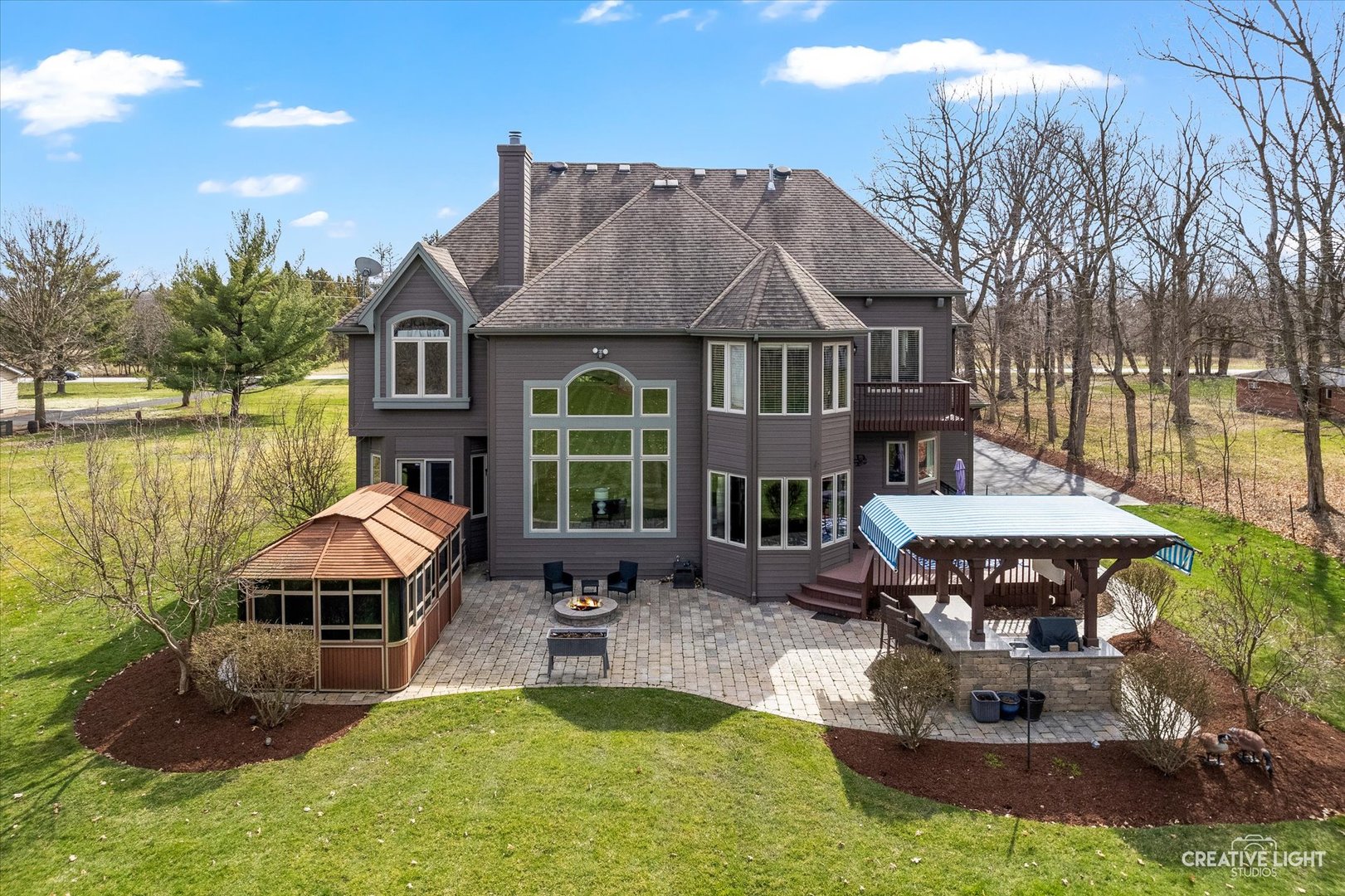 2086 Bilter Road Aurora, IL 60502 - Photo 3 of 59 a view of a house with backyard water fountain and sitting area