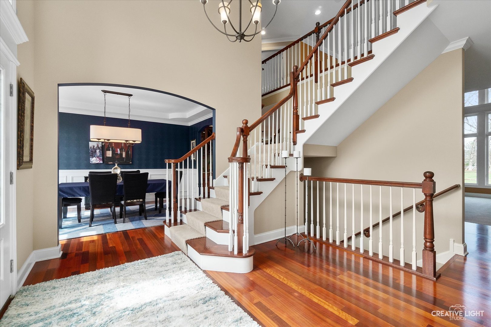 2086 Bilter Road Aurora, IL 60502 - Photo 9 of 59 a view of staircase with a rug and a chandelier