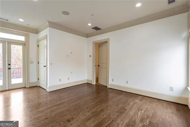 an empty room with wooden floor