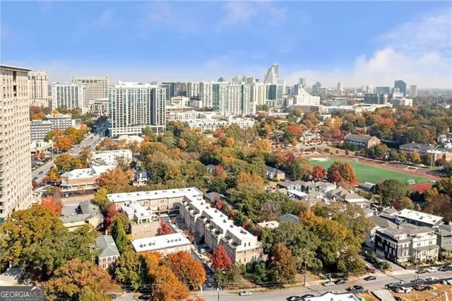 an aerial view of a house with yard