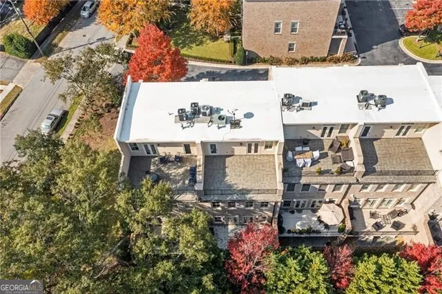 aerial view of a house with a yard