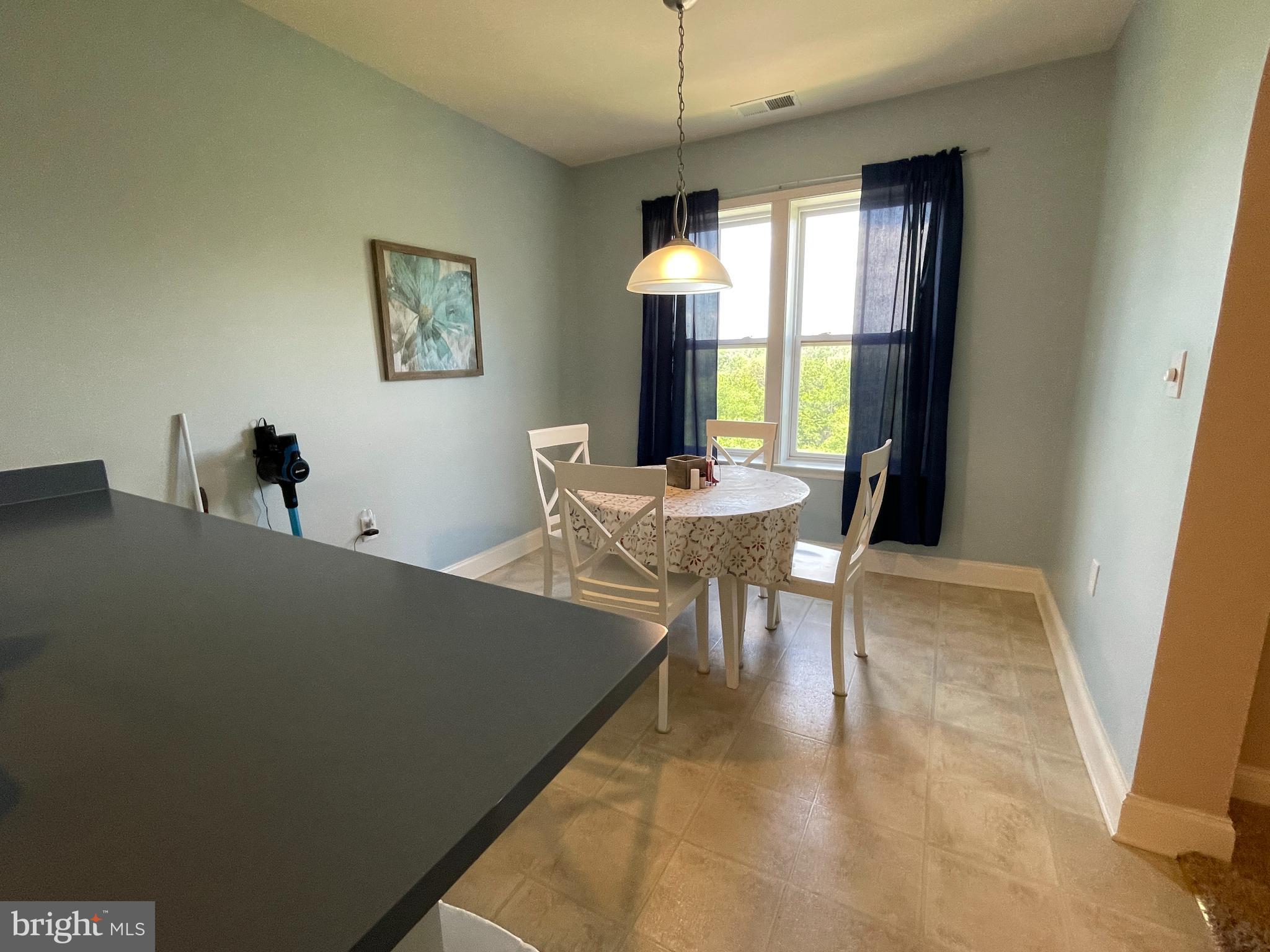 2250 Bear Den Road, Unit 308 Frederick, MD 21701 - Photo 27 of 71 a dining room with furniture and window