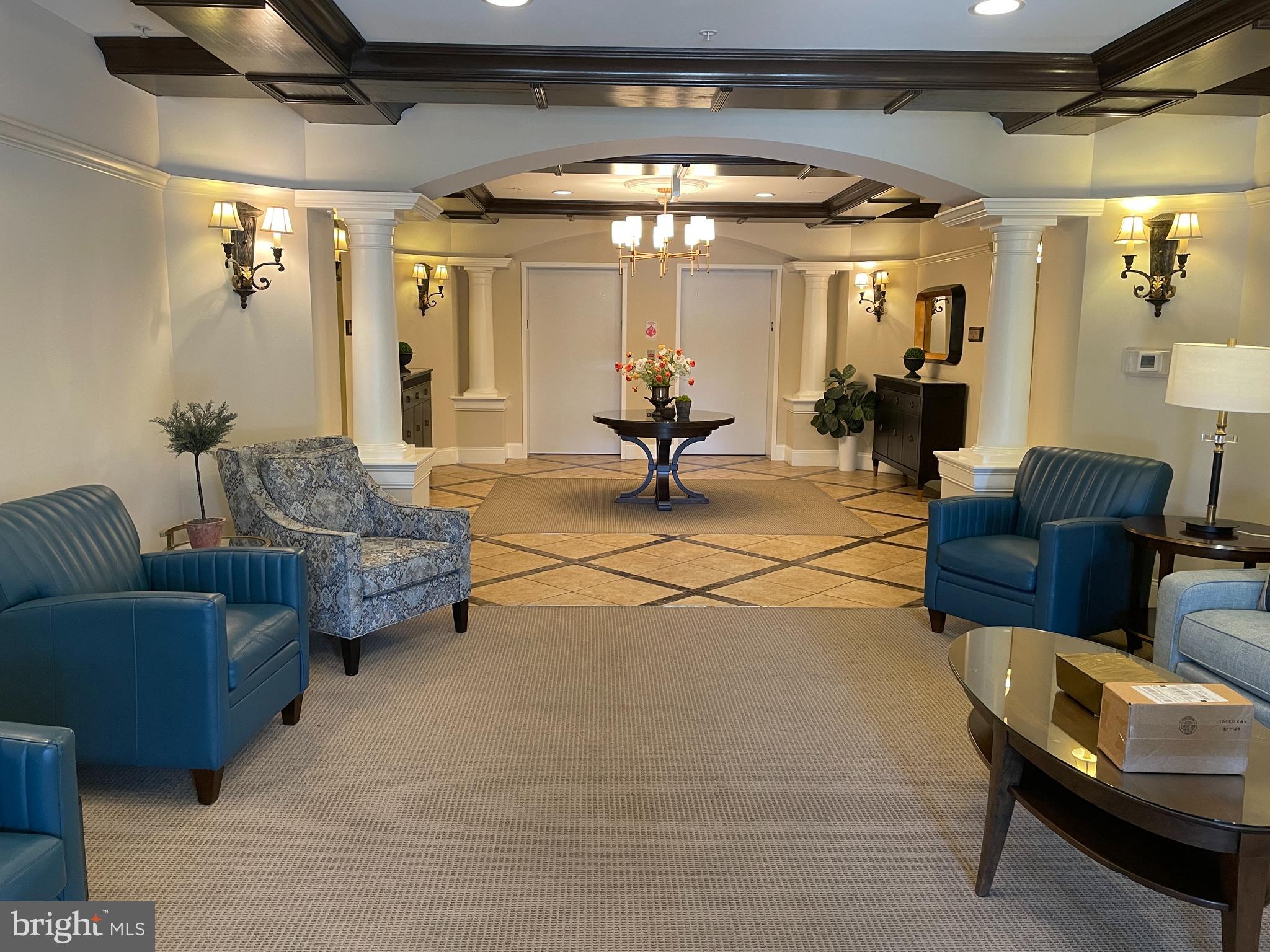 2250 Bear Den Road, Unit 308 Frederick, MD 21701 - Photo 4 of 71 a living room with furniture and a chandelier