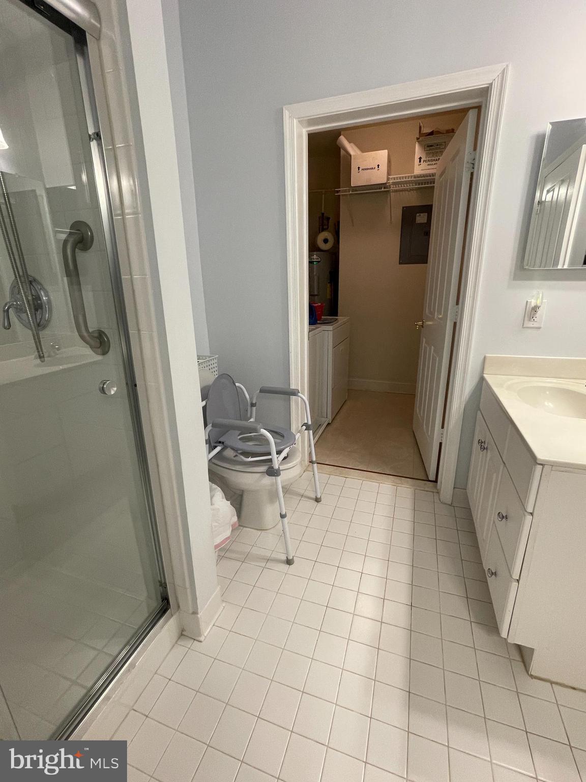 2250 Bear Den Road, Unit 308 Frederick, MD 21701 - Photo 49 of 71 a bathroom with a sink a toilet and shower