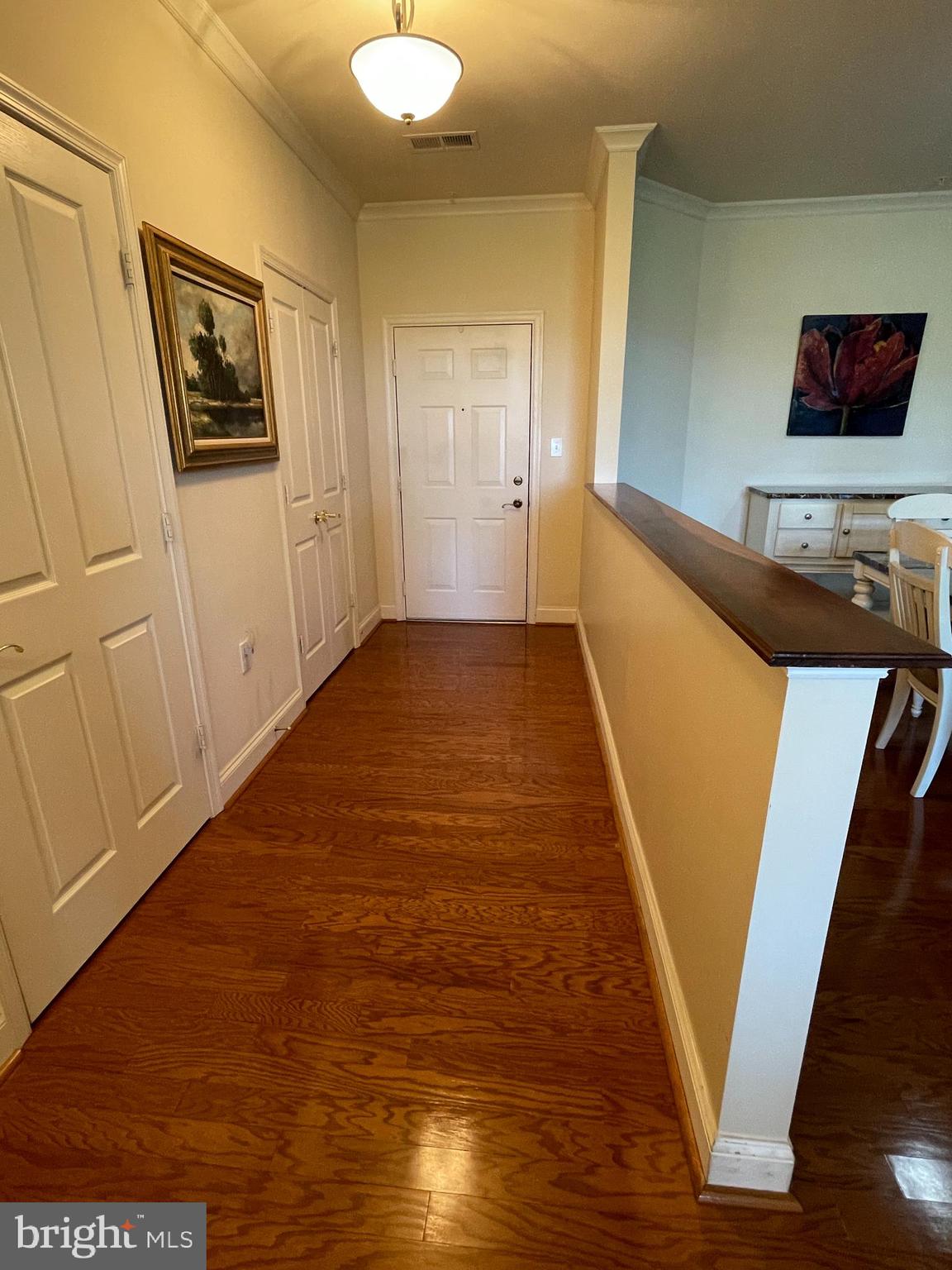 2250 Bear Den Road, Unit 308 Frederick, MD 21701 - Photo 8 of 71 a view of a hallway with wooden floor and staircase