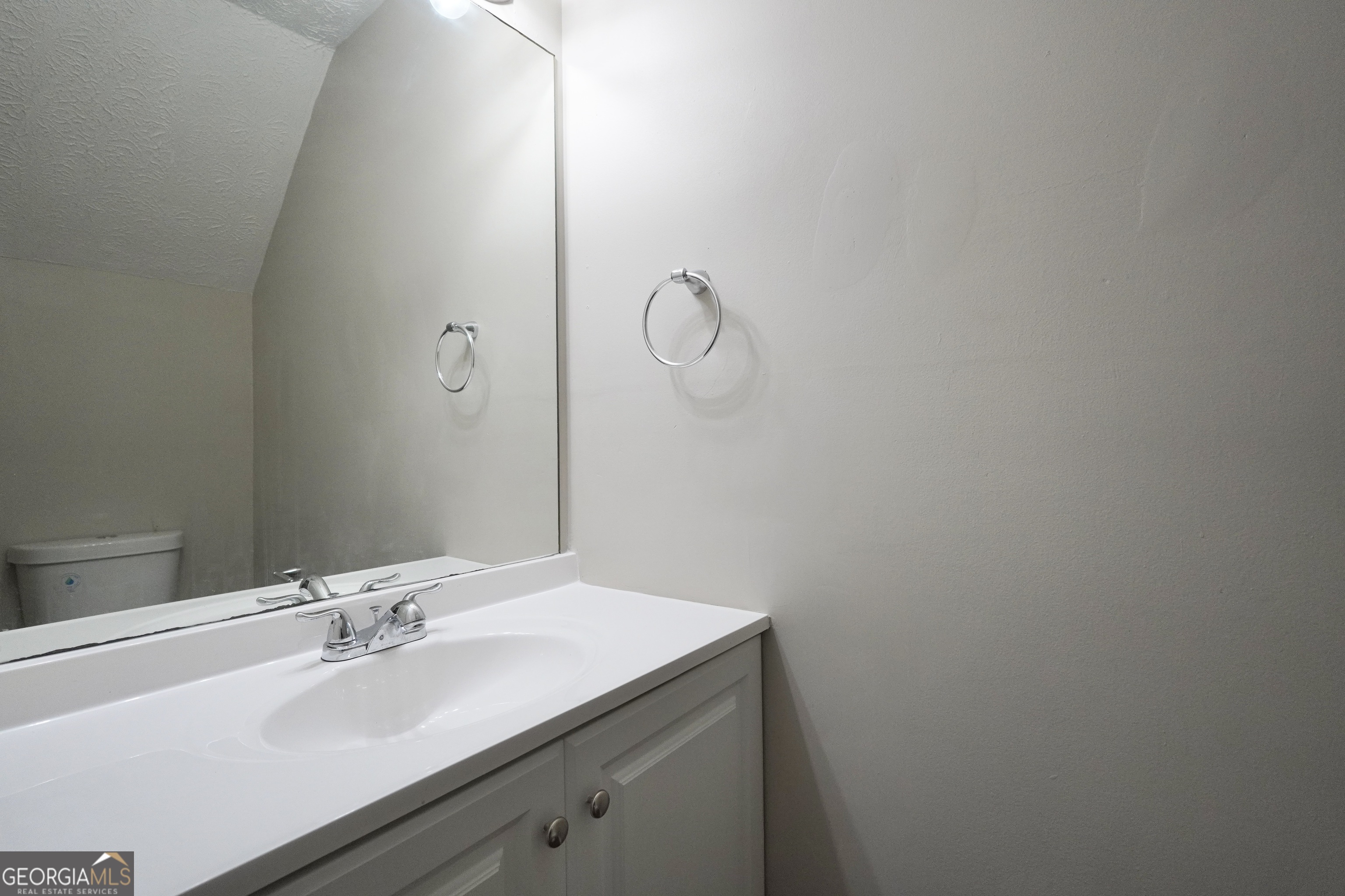 5702 Wells Circle Stone Mountain, GA 30087 - Photo 16 of 29 a bathroom with a sink and vanity