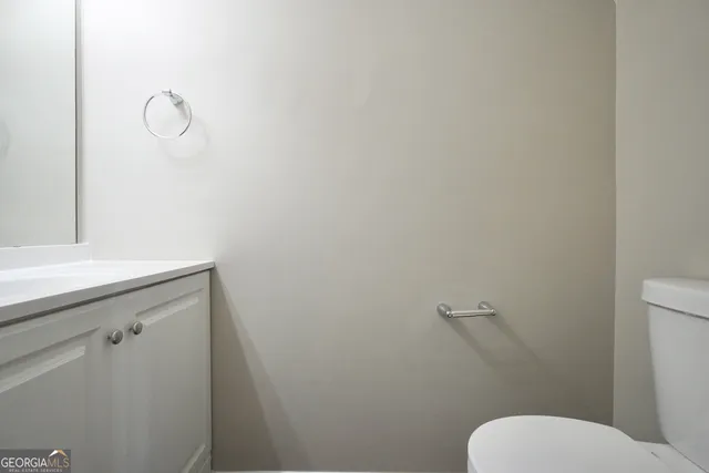 a bathroom with a toilet and a sink