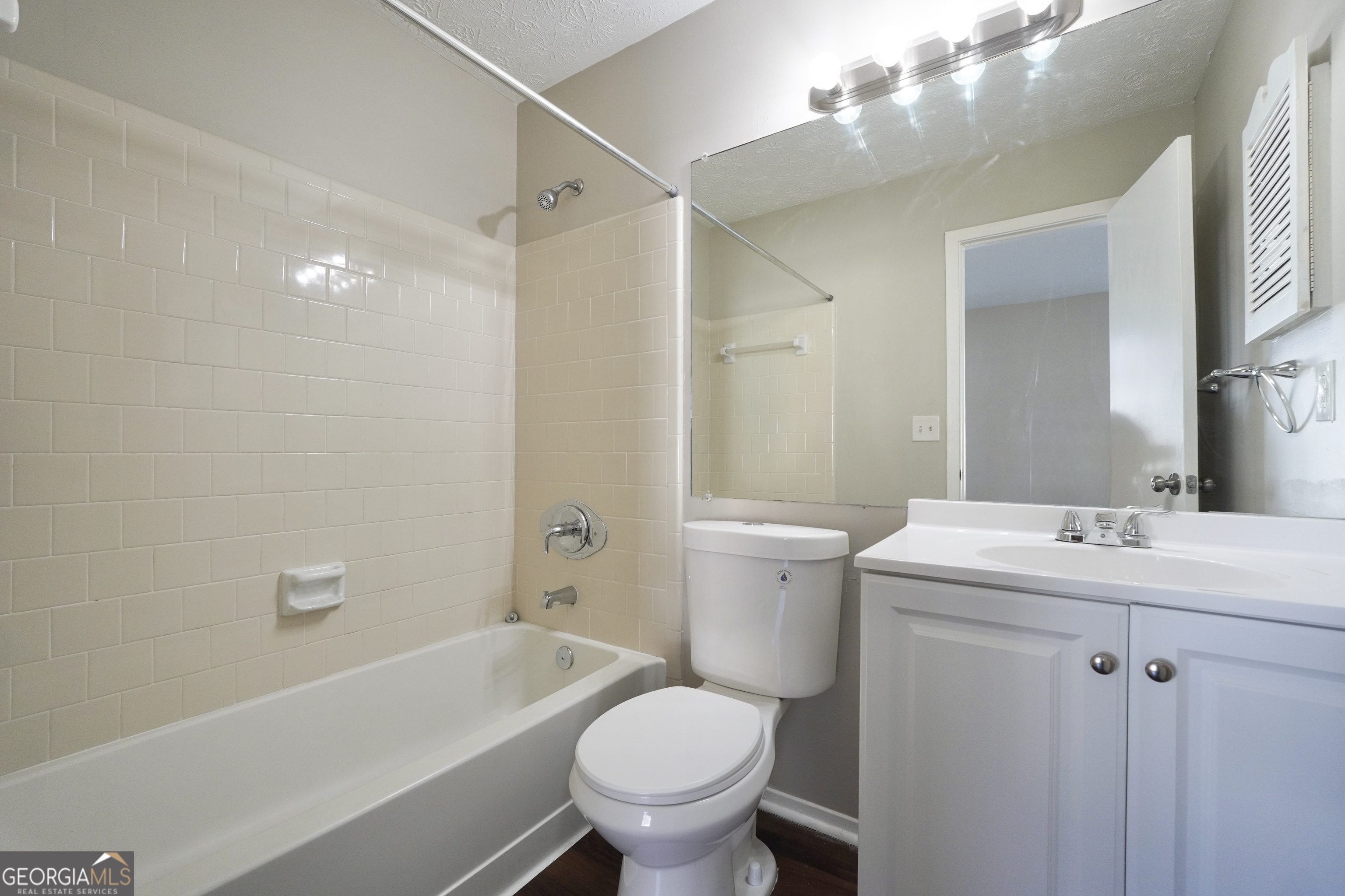 5702 Wells Circle Stone Mountain, GA 30087 - Photo 20 of 29 a bathroom with a toilet a sink and a bathtub