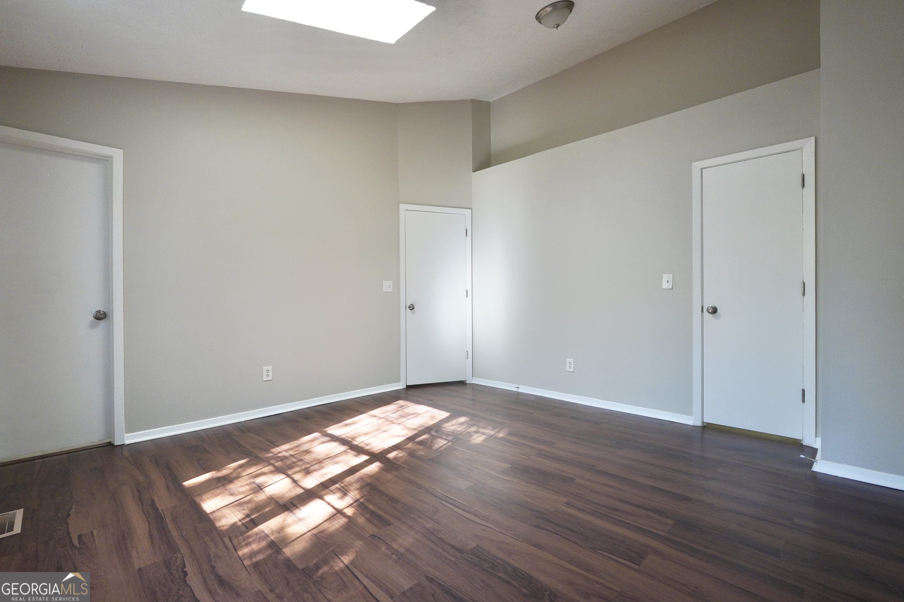 5702 Wells Circle Stone Mountain, GA 30087 - Photo 22 of 29 a view of an empty room and wooden floor