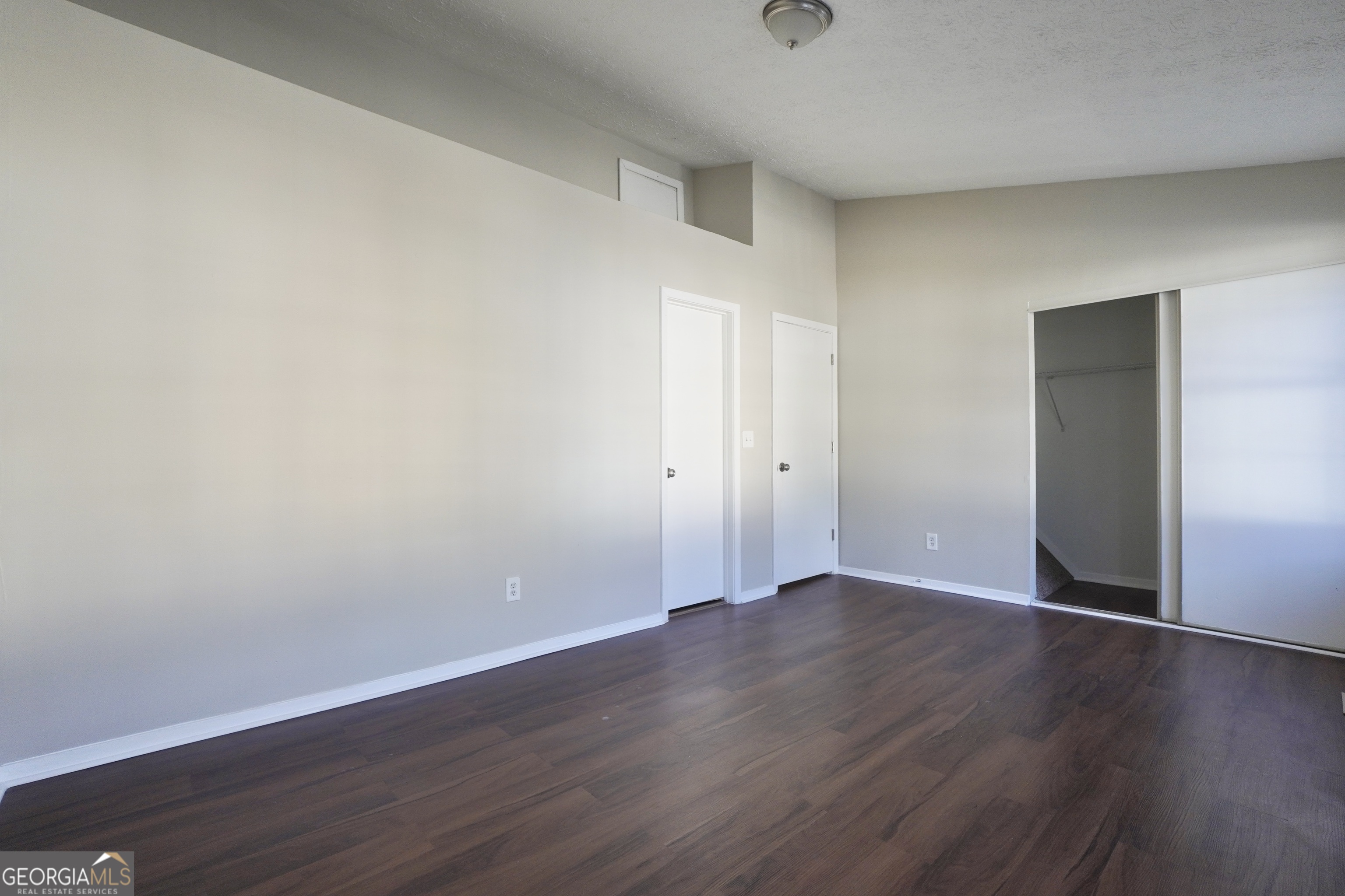 5702 Wells Circle Stone Mountain, GA 30087 - Photo 24 of 29 a view of an empty room with wooden floor