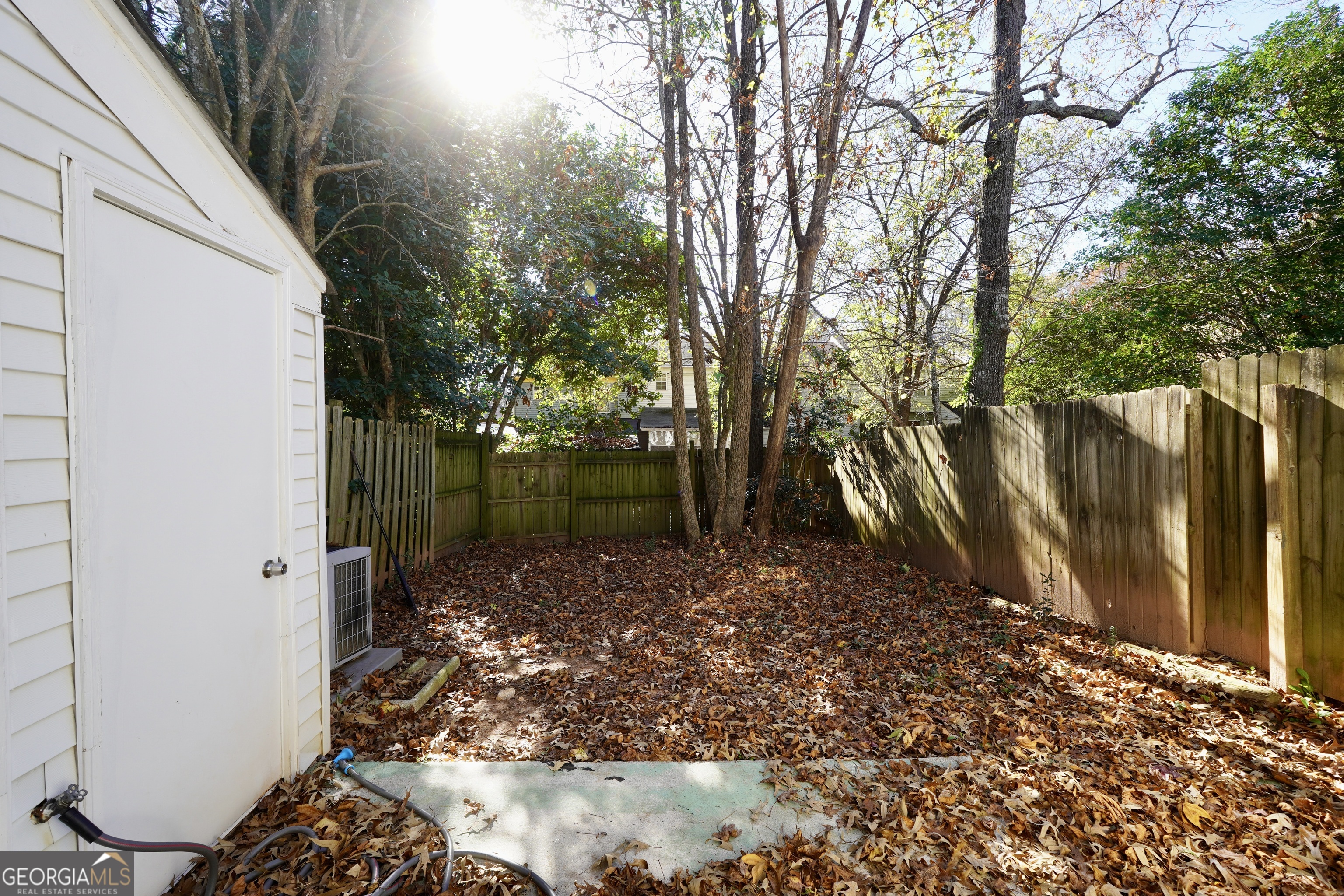 5702 Wells Circle Stone Mountain, GA 30087 - Photo 27 of 29 a backyard of a house with lots of green space