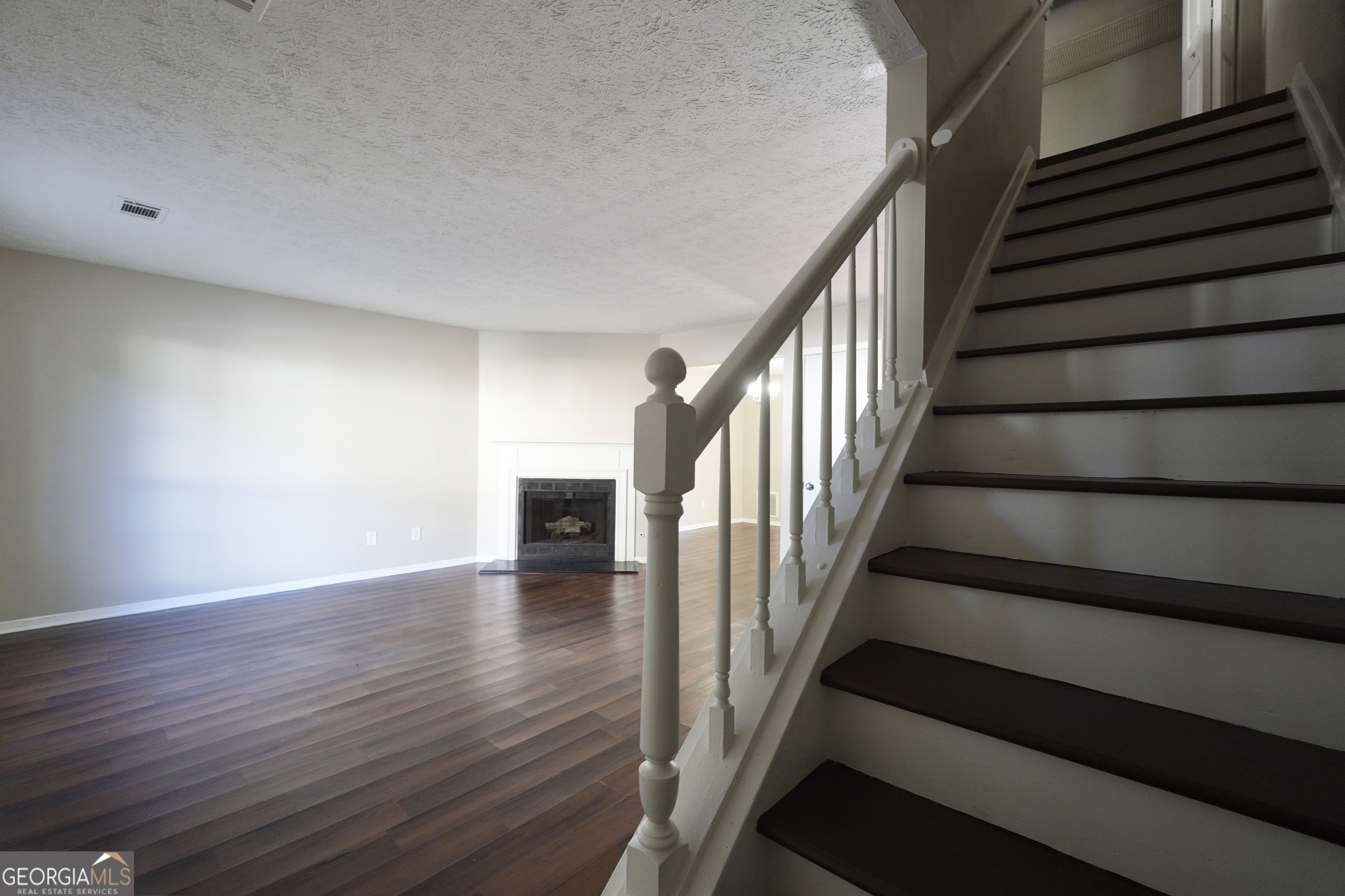 5702 Wells Circle Stone Mountain, GA 30087 - Photo 3 of 29 a view of entryway with wooden floor and stairs