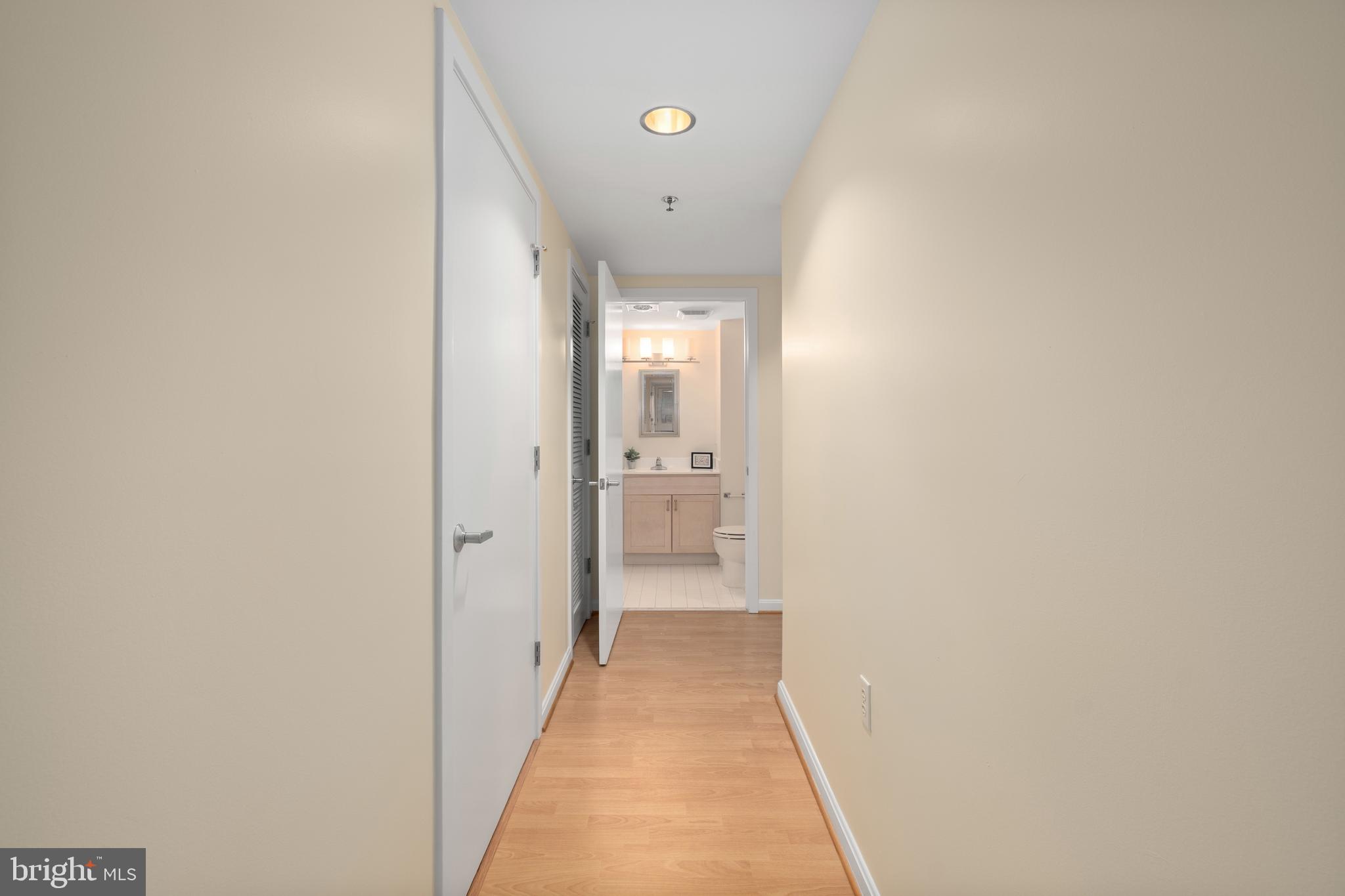 7981 Eastern Avenue Northwest, Unit 219 Silver Spring, MD 20910 - Photo 18 of 45 Hallway to bathrooms and bedrooms