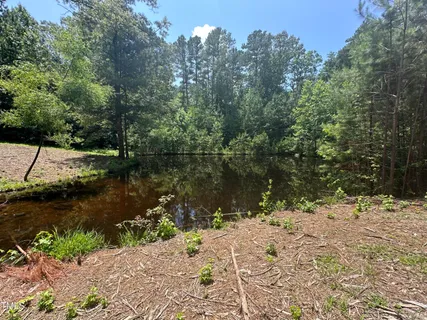 a view of lake with a yard