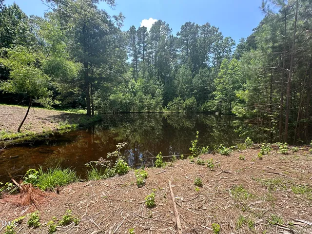 a view of lake with a yard