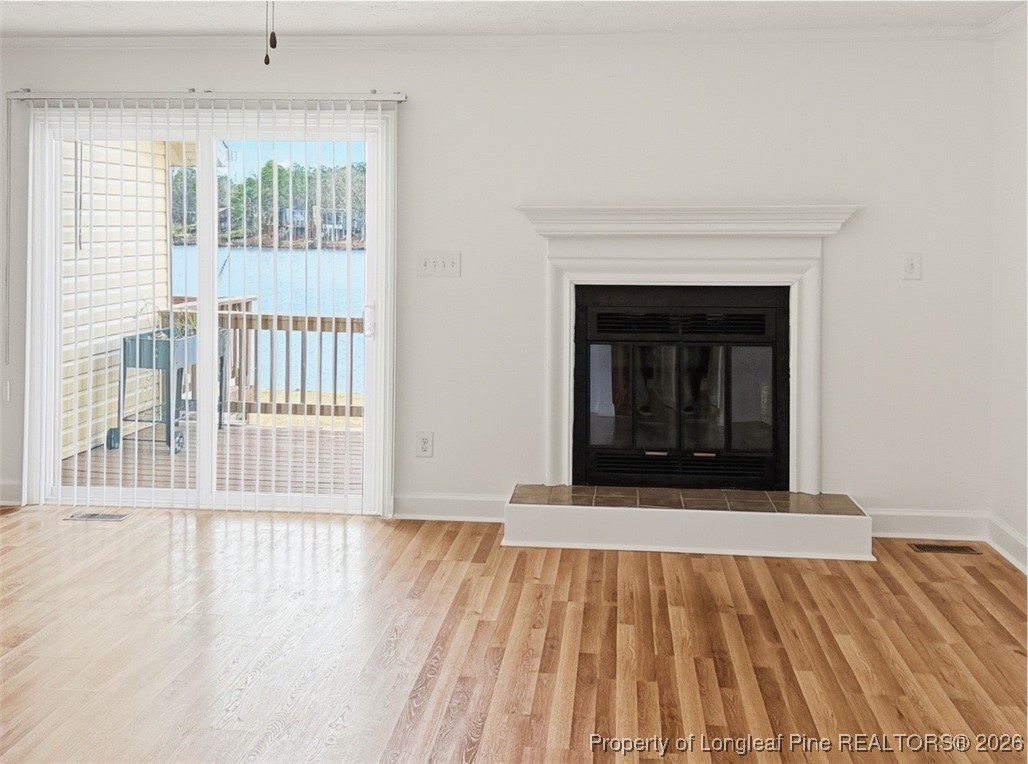 492 Lands End Road Fayetteville, NC 28314 - Photo 13 of 39 a view of an empty room with wooden floor and a window