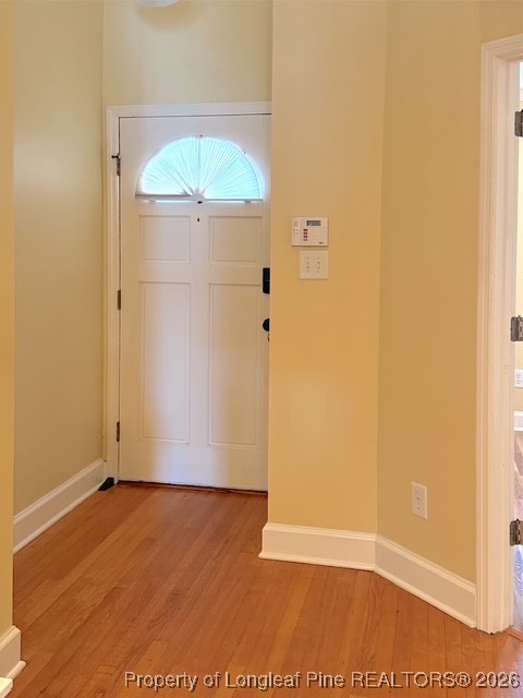 492 Lands End Road Fayetteville, NC 28314 - Photo 8 of 39 an empty room with wooden floor and cabinet