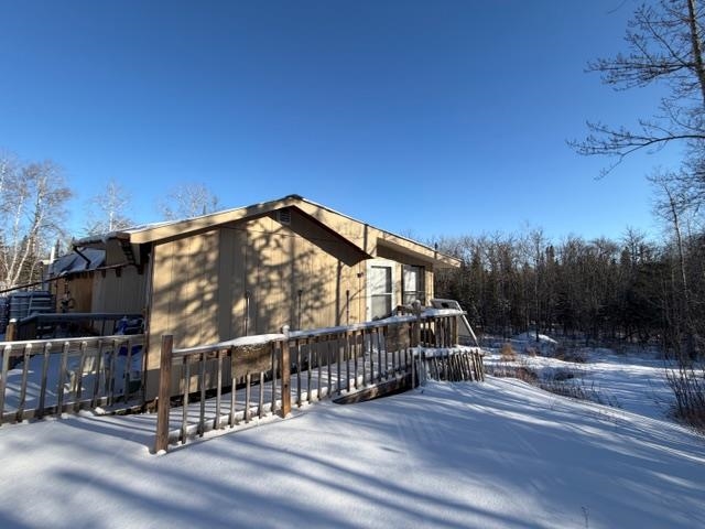 1152 Fernberg Road Ely, MN 55731 - Photo 24 of 24 View of snow covered exterior with a deck