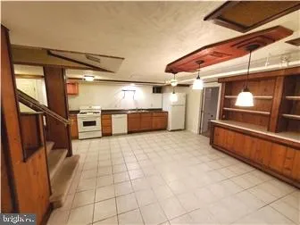 a view of an empty room with wooden walls