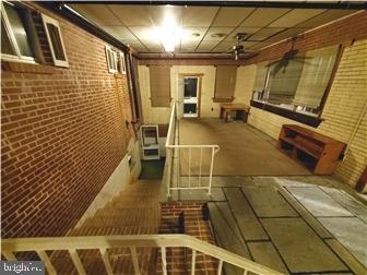 802 13th Street, Unit B New Castle, DE 19720 - Photo 2 of 17 a bathroom with a sink and mirror